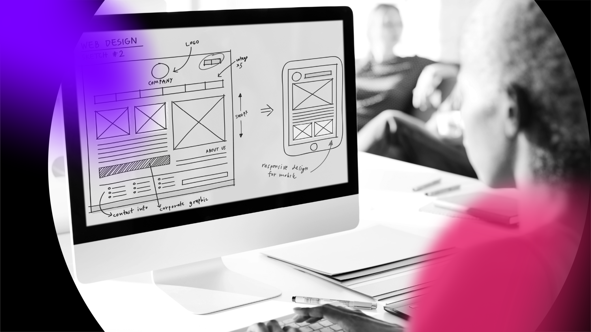 A person sits at a desk viewing a computer screen displaying a black-and-white wireframe design for a website and mobile layout, with notes and sketches. Two people from the web design agency are blurred in the background.